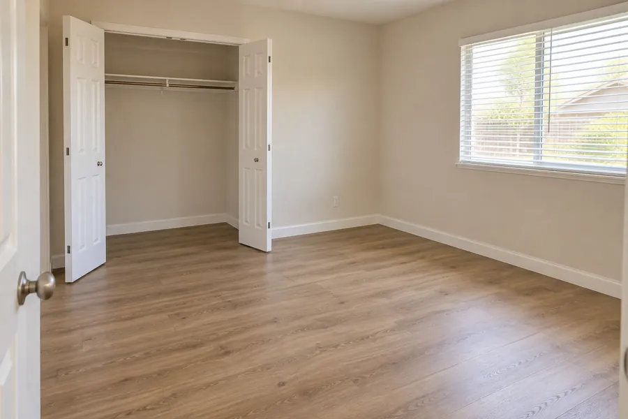 An empty bedroom, clean and ready for a walkthrough.